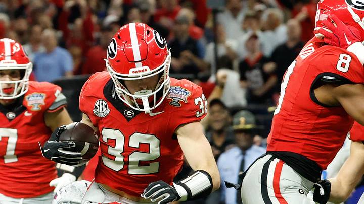 Jan 1, 2026; New Orleans, LA, USA; Mississippi Rebels cornerback Chris Graves Jr. (32) tackles Georgia Bulldogs running back Cash Jones (32) in the second quarter during the 2026 Sugar Bowl and quarterfinal game of the College Football Playoff at Caesars Superdome. Mandatory Credit: Amber Searls-Imagn Images