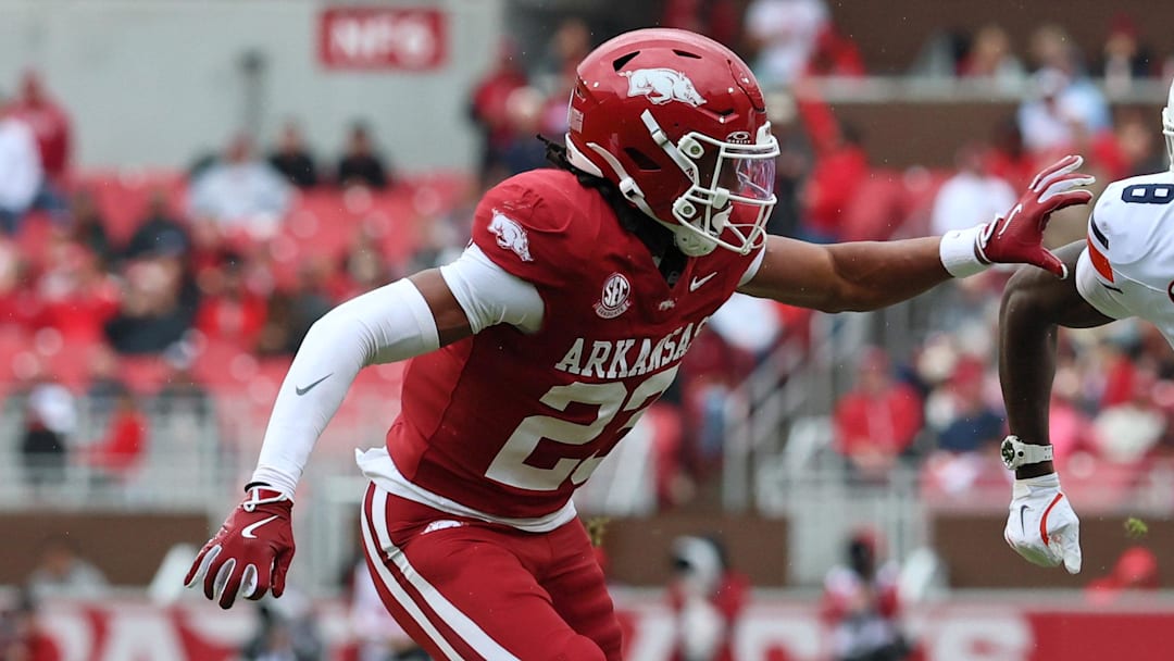 Oct 25, 2025; Fayetteville, Arkansas, USA; Auburn Tigers wide receiver Cam Coleman (8) runs a route resulting in a touchdown catch as Arkansas Razorbacks defensive back Julian Neal (23) defends during the first quarter at Donald W. Reynolds Razorback Stadium. Mandatory Credit: Nelson Chenault-Imagn Images