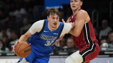 Nov 24, 2025; Miami, Florida, USA; Dallas Mavericks forward Cooper Flagg (32) drives to the basket against the Miami Heat during the second half at Kaseya Center. Mandatory Credit: Jim Rassol-Imagn Images