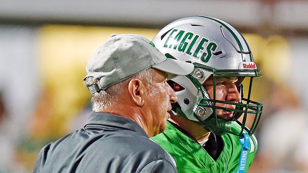 Hokes Bluff Coach Mike Robertson talks with quarterback Dean Morgan during high school football action in Hokes Bluff, Alabama August 27, 2026.  (Dave Hyatt / Hyatt Media LLC)