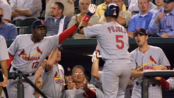 St. Louis Cardinals' Albert Pujols (5) is congratu