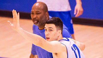Florida Gators Associate Head Coach Carlin Hartman helped Florida Gators guard Viktor Mikic (12) with a drill as the Florida Gators men’s basketball team held a practice on John W. Frost II Practice Court in Gainesville, FL on Tuesday, September 24, 2024. [Doug Engle/Gainesville Sun]