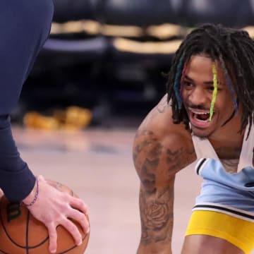 Apr 19, 2022; Memphis, Tennessee, USA; Memphis Grizzlies guard Ja Morant (12) practices during warm-ups before game two of the first round for the 2022 NBA playoffs at FedExForum. 