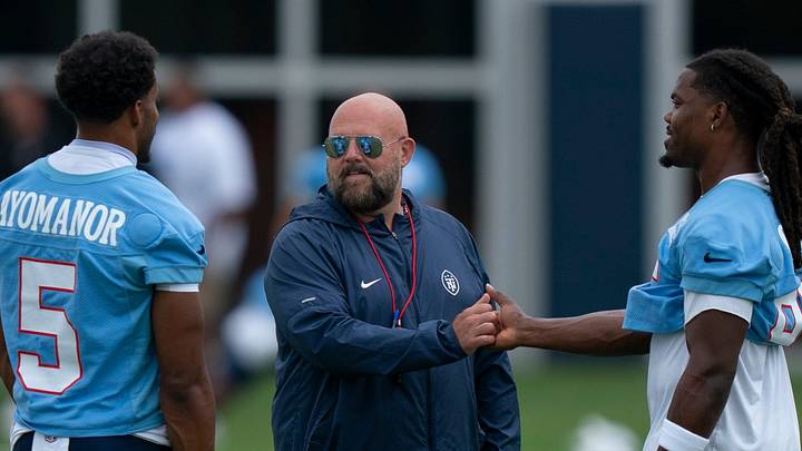Tennessee Titans wide receivers Elic Ayomanor (5) and K.J. Osborn (85) talk with Offensive Coordinator Brian Daboll