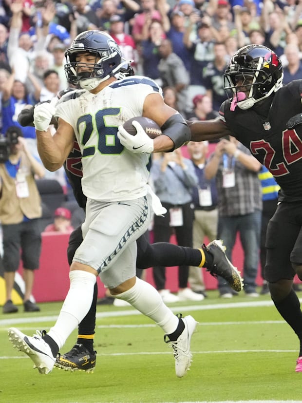 Seattle Seahawks running back Zach Charbonnet (26) runs for a touchdown against Arizona Cardinals cornerback Starling Thomas