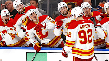 Oct 8, 2025; Edmonton, Alberta, CAN; The Calgary Flames celebrate a first career NHL goal scored by Matvei Gridin (92) during the second period against the Edmonton Oilers at Rogers Place. Mandatory Credit: Perry Nelson-Imagn Images