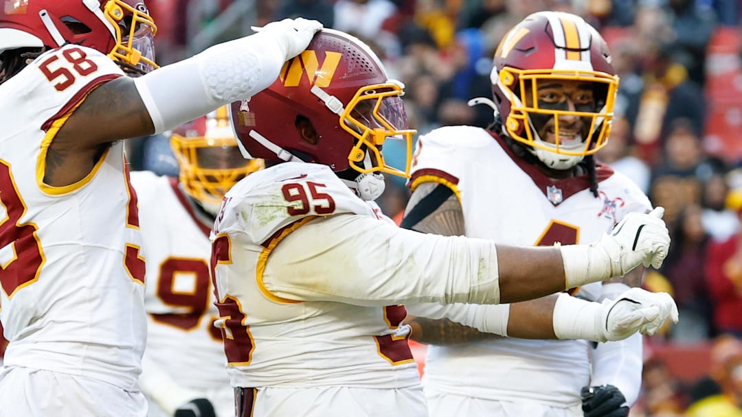 Dec 25, 2025; Landover, Maryland, USA; Washington Commanders defensive tackle Jer'Zhan Newton (95) celebrates after a sack against the Dallas Cowboys in the third quarter at Northwest Stadium. Mandatory Credit: Geoff Burke-Imagn Images