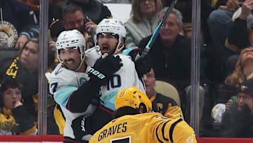 Nov 22, 2025; Pittsburgh, Pennsylvania, USA;  Seattle Kraken right wing Jordan Eberle (7) and center Matty Beniers (10) celebrate a goal by Beniers as Pittsburgh Penguins defenseman Ryan Graves (27) reacts during the third period at PPG Paints Arena. Mandatory Credit: Charles LeClaire-Imagn Images