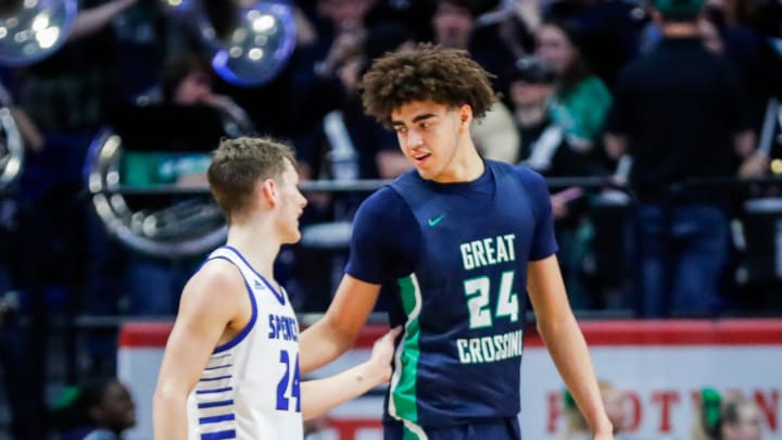 Spencer County's Camden Cox (24) and Great Crossing's Malachi Moreno (24) come together after the No.1 Warhawks rallied to beat the much smaller but tough Spencer team in the first round of the 2024 UK Healthcare KHSAA Boys' Sweet 16 in Lexington. March 20, 2024