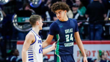 Spencer County's Camden Cox (24) and Great Crossing's Malachi Moreno (24) come together after the No.1 Warhawks rallied to beat the much smaller but tough Spencer team in the first round of the 2024 UK Healthcare KHSAA Boys' Sweet 16 in Lexington. March 20, 2024