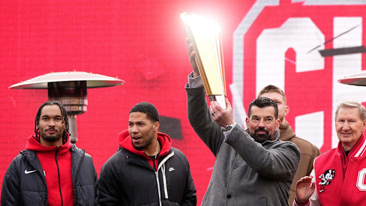 Ohio State Buckeyes head coach Ryan Day hoists the championship trophy during the Ohio State Buckeyes College Football Playoff National Championship celebration at Ohio Stadium in Columbus on Jan. 26, 2025.
