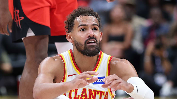Hawks guard Trae Young (11) reacts during a game against the Rockets. 