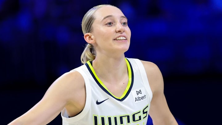 Jul 3, 2025; Arlington, Texas, USA;  Dallas Wings guard Paige Bueckers (5) reacts against the Phoenix Mercury  during the first half at College Park Center. Mandatory Credit: Kevin Jairaj-Imagn Images