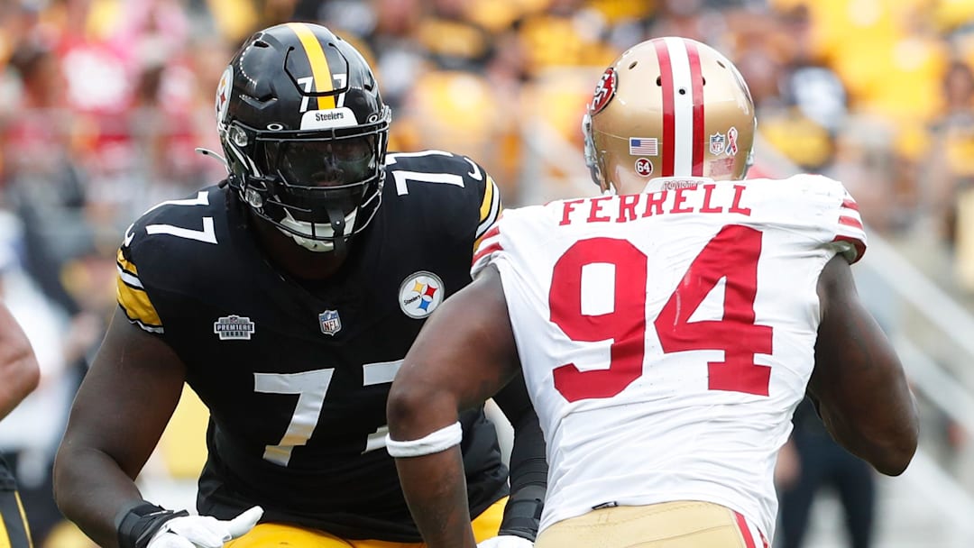 Sep 10, 2023; Pittsburgh, Pennsylvania, USA;  Pittsburgh Steelers offensive tackle Broderick Jones (77) blocks against San Francisco 49ers defensive end Clelin Ferrell (94) during the fourth quarter at Acrisure Stadium. Mandatory Credit: Charles LeClaire-Imagn Images