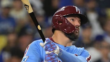 Oct 8, 2025; Los Angeles, California, USA; Philadelphia Phillies designated hitter Kyle Schwarber (12) watches the flight of the ball a solo home run during the fourth inning against the Los Angeles Dodgers in game three of the NLDS during the 2025 MLB playoffs at Dodger Stadium. Mandatory Credit: Jayne Kamin-Oncea-Imagn Images