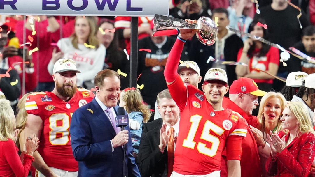 Feb 11, 2024; Paradise, Nevada, USA;  Kansas City Chiefs quarterback Patrick Mahomes (15) hoists the Vince Lombardi Trophy after defeating the San Francisco 49ers in Super Bowl LVIII at Allegiant Stadium. Mandatory Credit: Stephen R. Sylvanie-USA TODAY Sports