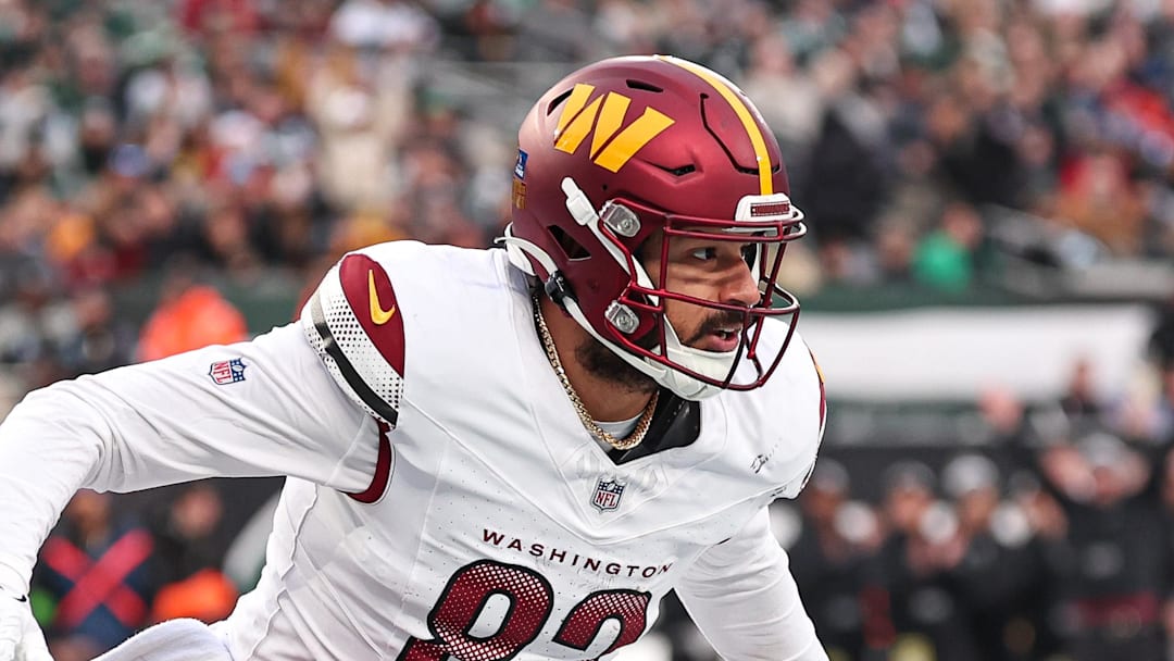 Dec 24, 2023; East Rutherford, New Jersey, USA; Washington Commanders tight end Logan Thomas (82) reacts after a touchdown reception during the second half against the New York Jets at MetLife Stadium. Mandatory Credit: Vincent Carchietta-Imagn Images 