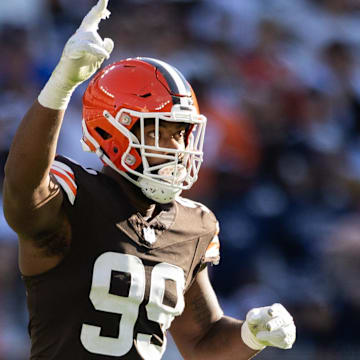 Sep 8, 2024; Cleveland, Ohio, USA; Cleveland Browns defensive end Za'Darius Smith (99) celebrates his sack against the Dallas Cowboys during the second quarter at Huntington Bank Field. Mandatory Credit: Scott Galvin-Imagn Images