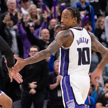 Jan 6, 2025; Sacramento, California, USA; Sacramento Kings head coach Doug Christie celebrates with forward DeMar DeRozan (10) in double overtime in the game against the Miami Heat at Golden 1 Center. Mandatory Credit: Ed Szczepanski-Imagn Images