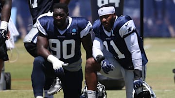 Jul 30, 2024; Oxnard, CA, USA; Dallas Cowboys defensive end DeMarcus Lawrence (90) and linebacker Micah Parsons (11) during training camp at the River Ridge Playing Fields in Oxnard, California. Mandatory Credit: Jason Parkhurst-Imagn Images