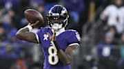 Dec 21, 2024; Baltimore, Maryland, USA;  Baltimore Ravens quarterback Lamar Jackson (8) throws during the first half against the Pittsburgh Steelers at M&T Bank Stadium. Mandatory Credit: Tommy Gilligan-Imagn Images