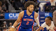 Feb 5, 2025; Detroit, Michigan, USA; Detroit Pistons guard Cade Cunningham (2) moves the ball up court as center Isaiah Stewart (28) sets a pick on Cleveland Cavaliers guard Darius Garland (10) during the first half at Little Caesars Arena. Mandatory Credit: David Reginek-Imagn Images