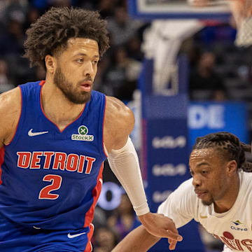 Feb 5, 2025; Detroit, Michigan, USA; Detroit Pistons guard Cade Cunningham (2) moves the ball up court as center Isaiah Stewart (28) sets a pick on Cleveland Cavaliers guard Darius Garland (10) during the first half at Little Caesars Arena. Mandatory Credit: David Reginek-Imagn Images