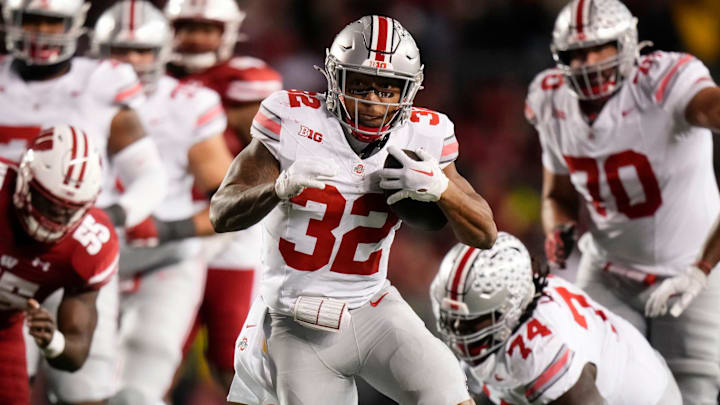 Oct 28, 2023; Madison, Wisconsin, USA; Ohio State Buckeyes running back TreVeyon Henderson (32) runs for a 33-yard touchown during the second half of the NCAA football game against the Wisconsin Badgers at Camp Randall Stadium. Ohio State won 24-10. Oct 28, 2023; Madison, Wisconsin, USA; Ohio State Buckeyes running back TreVeyon Henderson (32) runs for a 33-yard touchown during the second half of the NCAA football game against the Wisconsin Badgers at Camp Randall Stadium. Ohio State won 24-10.