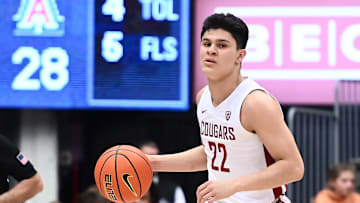 Jan 26, 2023; Pullman, Washington, USA; St. John's basketball guard Dylan Darling (22) controls the ball against the Arizona Wildcats in the first half at Friel Court at Beasley Coliseum.