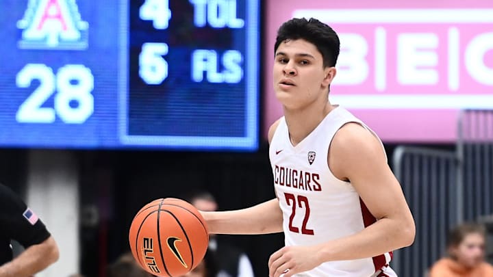 Jan 26, 2023; Pullman, Washington, USA; St. John's basketball guard Dylan Darling (22) controls the ball against the Arizona Wildcats in the first half at Friel Court at Beasley Coliseum.