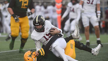 Bishop Manogue’s Kole Cronin sacks Faith Lutheran’s Alexander Rogers.