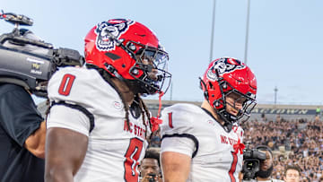 Sep 11, 2025; Winston-Salem, North Carolina, USA;  North Carolina State Wolfpack win the coin toss against the Wake Forest Demon Deacons at Allegacy Federal Credit Union Stadium. Mandatory Credit: Luke Jamroz-Imagn Images