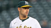 May 16, 2023; Oakland, California, USA; Oakland Athletics relief pitcher Garrett Acton (67) prepares to pitch during the fifth inning against the Arizona Diamondbacks at Oakland-Alameda County Coliseum. Mandatory Credit: Stan Szeto-Imagn Images
