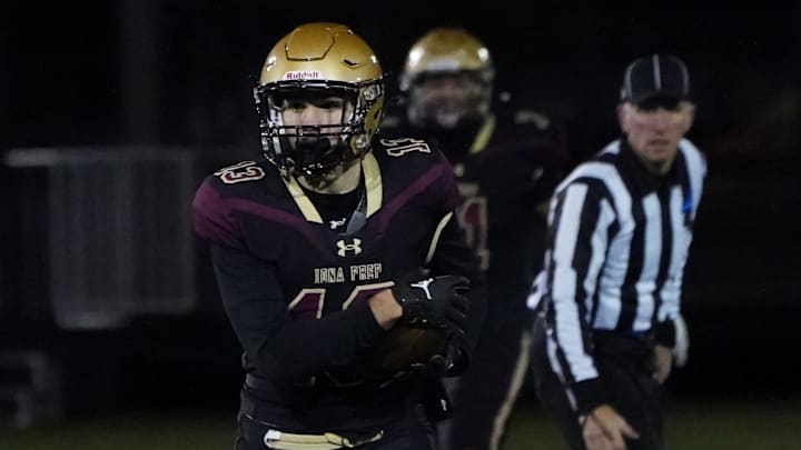 Iona Prep's Rocco Presto (13) pulls in a reception during the New York Catholic High School Football League AAA championship game against Cardinal Hayes at Fordham University in The Bronx on Saturday, November 2023. Cardinal Hayes won 30-29.