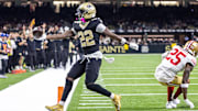 Sep 14, 2025; New Orleans, Louisiana, USA; New Orleans Saints wide receiver Rashid Shaheed (22) scores a touchdown against San Francisco 49ers safety Jason Pinnock (25) during the second half at Caesars Superdome. 