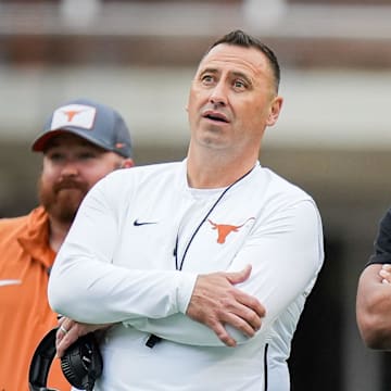 Texas Longhorns Head Coach Steve Sarkisian and former Longhorn Bijan Robinson watch the Longhorns' spring Orange and White game at Darrell K Royal Texas Memorial Stadium in Austin, Texas, April 20, 2024.