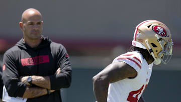 San Francisco 49ers defensive coordinator Robert Saleh (L)