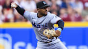 Jul 9, 2025; Cincinnati, Ohio, USA; Miami Marlins second baseman Xavier Edwards (9) throws to first to get Cincinnati Reds first baseman Spencer Steer (not pictured) out in the third inning at Great American Ball Park. Mandatory Credit: Katie Stratman-Imagn Images