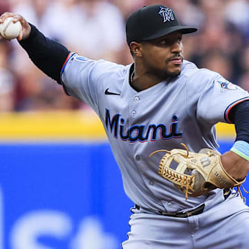 Jul 9, 2025; Cincinnati, Ohio, USA; Miami Marlins second baseman Xavier Edwards (9) throws to first to get Cincinnati Reds first baseman Spencer Steer (not pictured) out in the third inning at Great American Ball Park. Mandatory Credit: Katie Stratman-Imagn Images