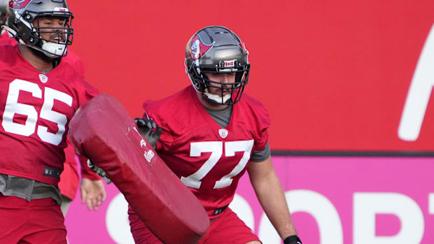 Tampa Bay Buccaneers offensive tackle Dylan Cook (65) and offensive tackle Justin Skule (77)  