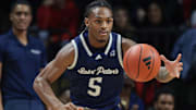 Nov 27, 2023; Piscataway, New Jersey, USA; St. Peter's Peacocks guard Armoni Zeigler (5) dribbles up court during the first half against the Rutgers Scarlet Knights at Jersey Mike's Arena. Mandatory Credit: Vincent Carchietta-Imagn Images