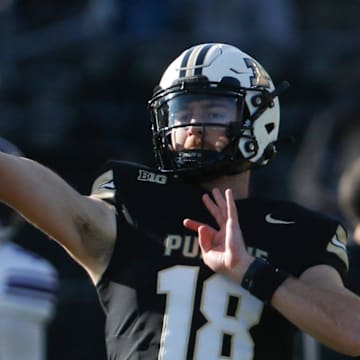 Purdue Boilermakers quarterback Bennett Meredith (18) throws the ball 