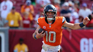 Sep 22, 2024; Tampa, Florida, USA; Denver Broncos quarterback Bo Nix (10) runs with the ball against the Tampa Bay Buccaneers during the second half at Raymond James Stadium. Mandatory Credit: Kim Klement Neitzel-Imagn Images