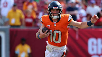 Sep 22, 2024; Tampa, Florida, USA; Denver Broncos quarterback Bo Nix (10) runs with the ball against the Tampa Bay Buccaneers during the second half at Raymond James Stadium. Mandatory Credit: Kim Klement Neitzel-Imagn Images