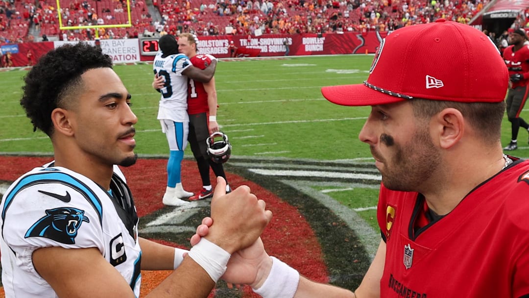 Tampa Bay Buccaneers quarterback Baker Mayfield greet Carolina Panthers quarterback Bryce Young.