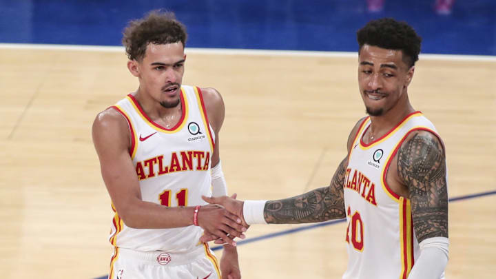 Jun 2, 2021; New York, New York, USA; Atlanta Hawks guard Trae Young (11) and forward John Collins (20) congratulate each other after defeating the New York Knicks 103-89 during game five in the first round of the 2021 NBA Playoffs at Madison Square Garden. Mandatory Credit: Wendell Cruz-Imagn Images