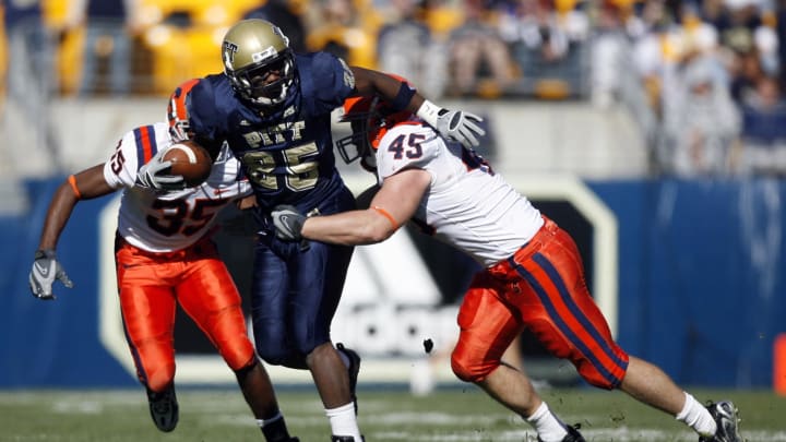 Nov 3, 2007; Pittsburgh , PA, USA; Pitt Panthers running back (25) LeSean McCoy is brought down by Syracuse Orange defensive back (35) Mike Holmes and linebacker (45) Jake Flaherty during their game at Heinz Field in Pittsburgh, PA. Mandatory Credit: Jason Bridge-USA TODAY Sports Copyright (c) 2007 Jason Bridge