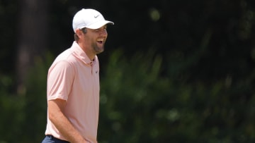 Scottie Scheffler shares a laugh on the second green during a practice round for the U.S. Open golf tournament at Pinehurst No. 2