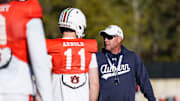 Auburn Tigers head coach Hugh Freeze works with new quarterback Jackson Arnold at spring practice.