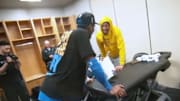 Oklahoma City Thunder's Shai Gilgeous-Alexander visits Indiana Pacers' Tyrese Haliburton in the locker room.